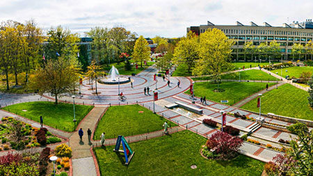 A panoramic photo of campus centered around the fountain.