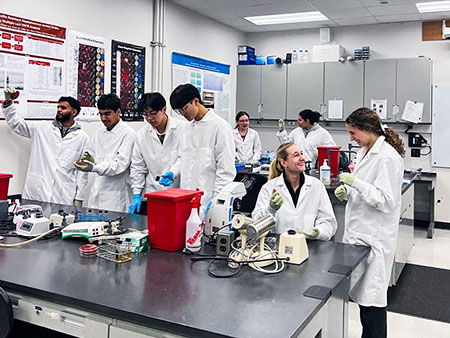 A group of students in a clinical laboratory,
